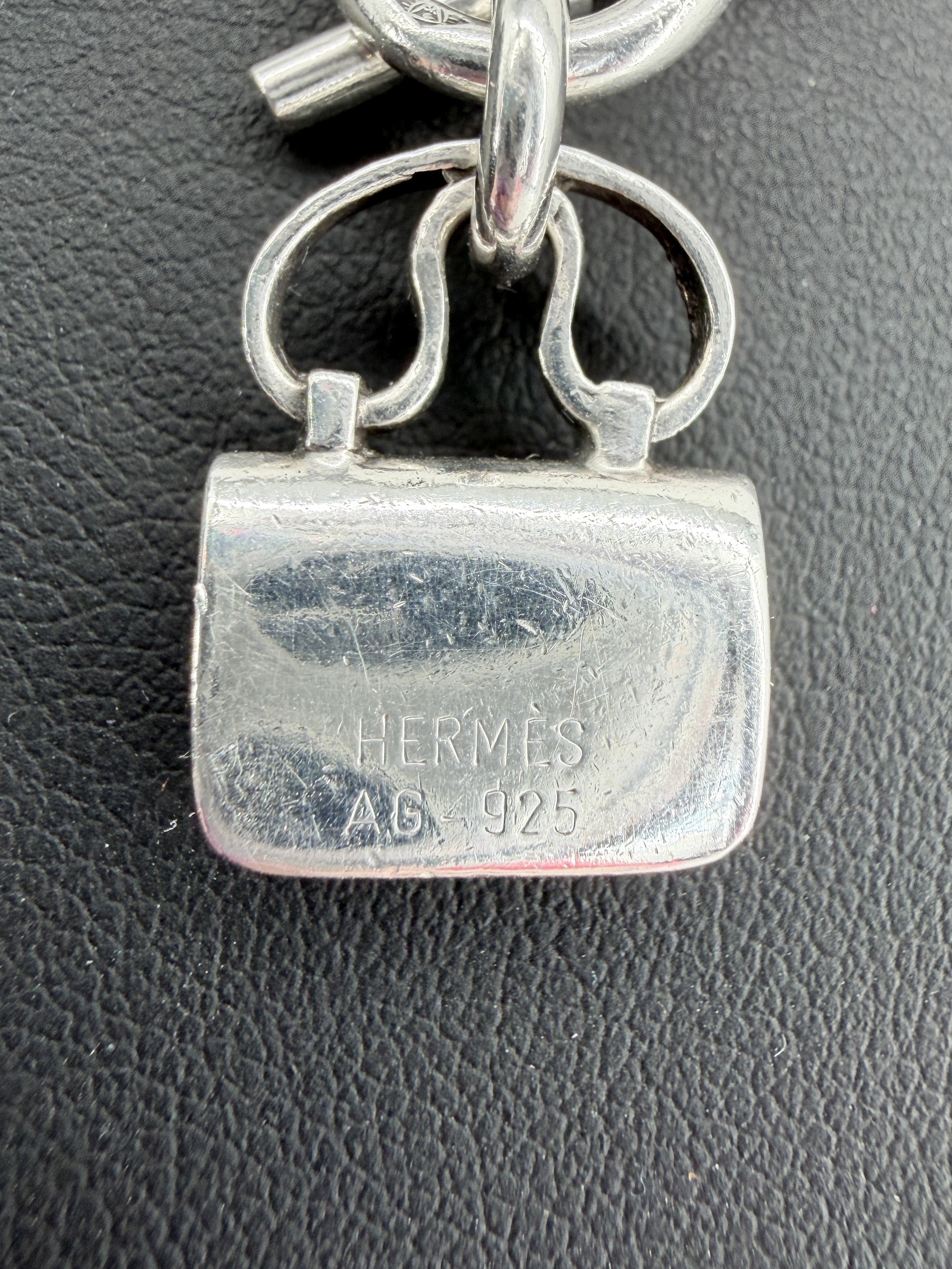 Hermès sterling silver Constance amulet necklace