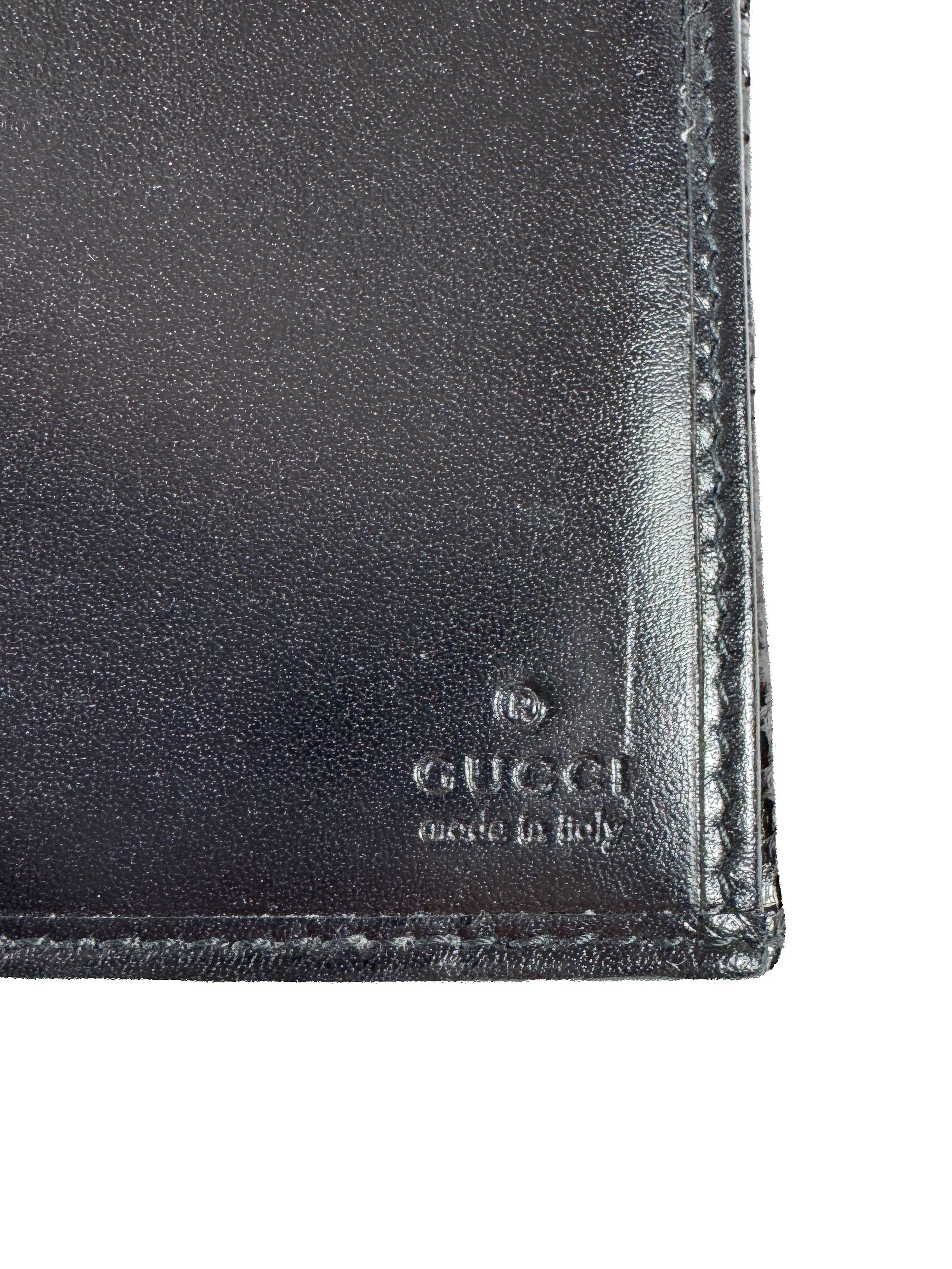 Gucci black embossed leather wallet 2067