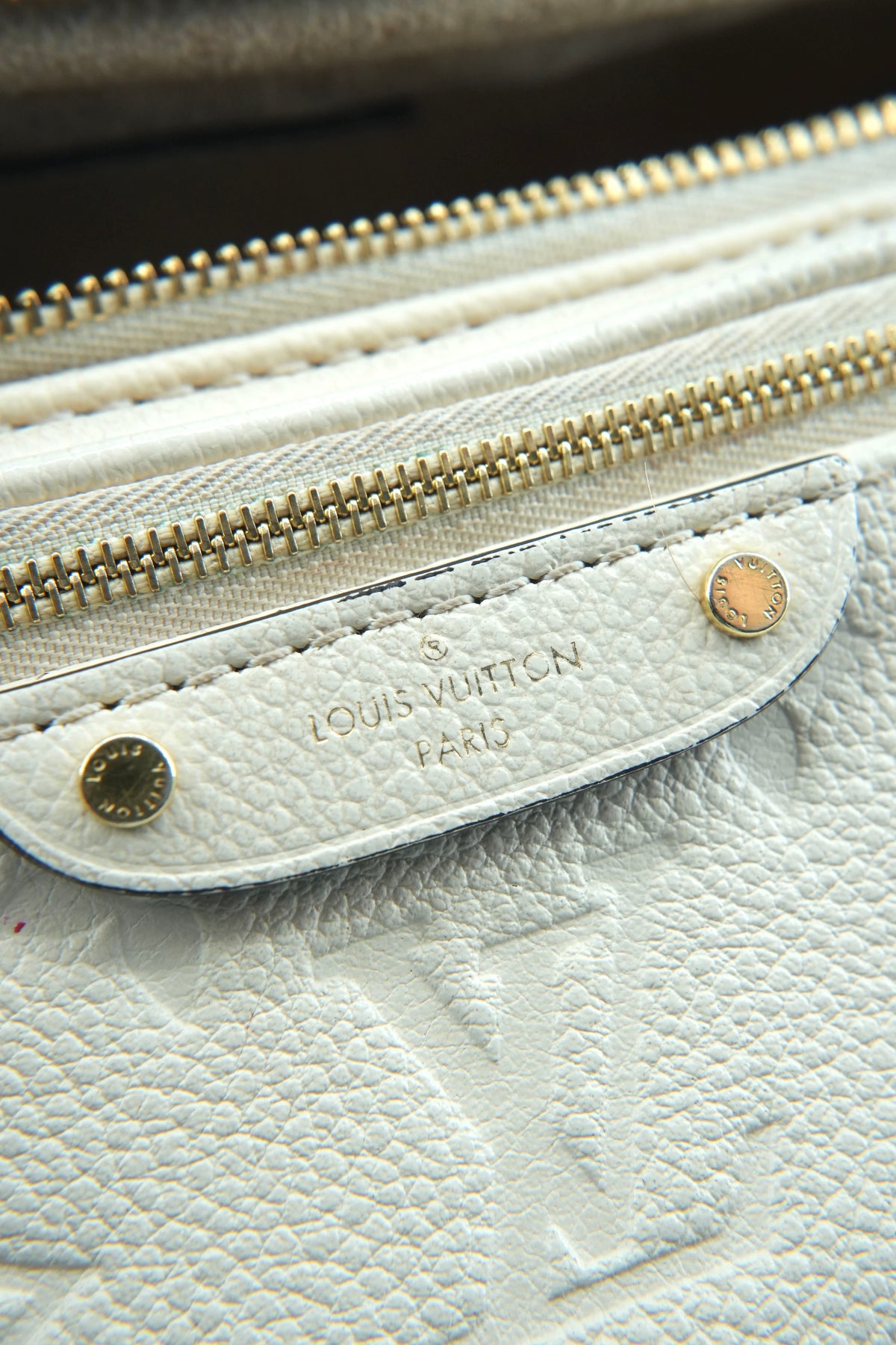 Louis Vuitton cream empreinte mini bumbag NFC