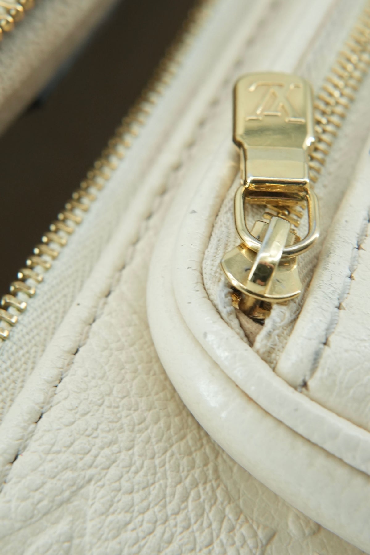 Louis Vuitton cream empreinte mini bumbag NFC