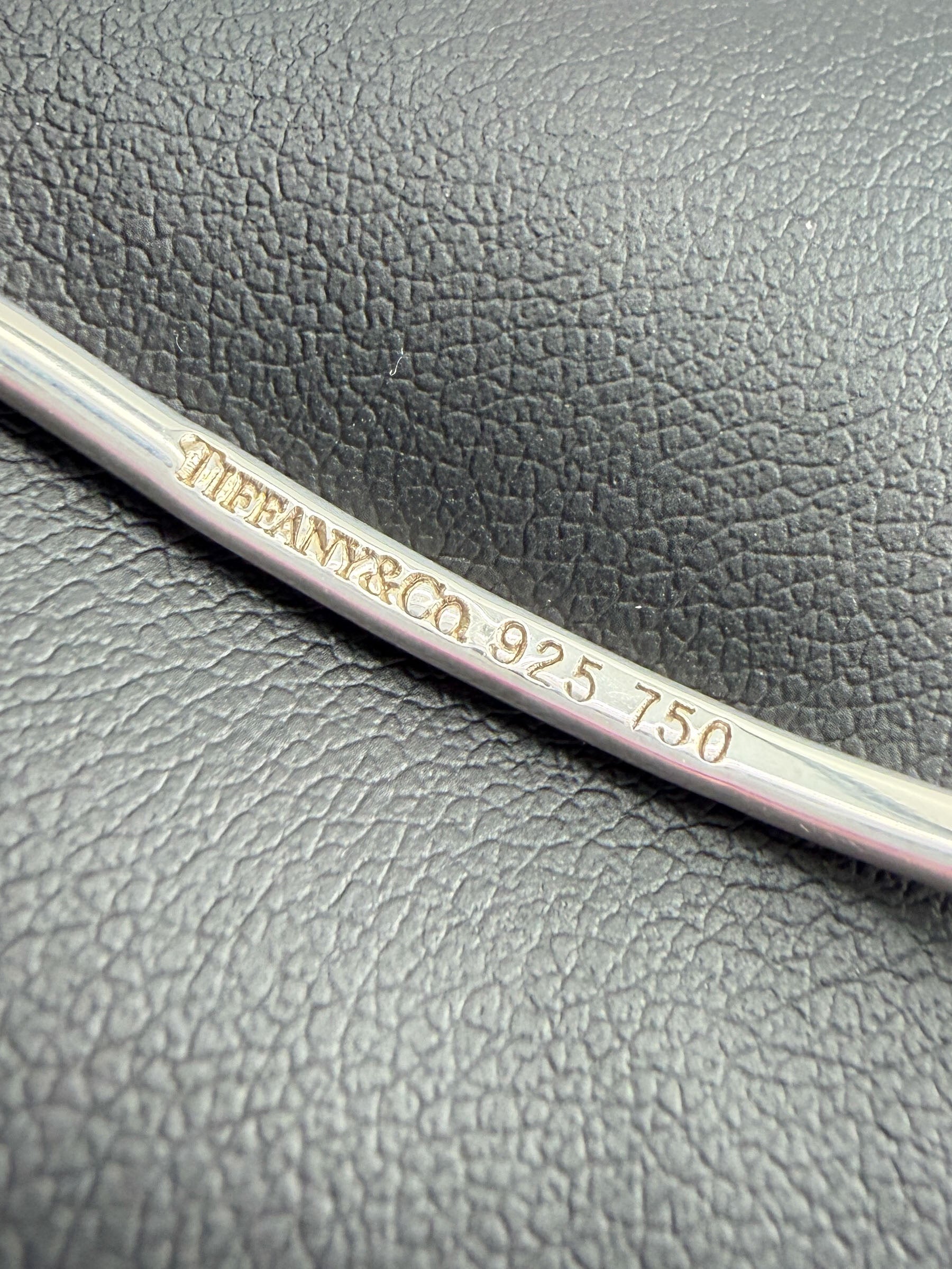 Tiffany & Co sterling silver, 18k yellow gold love knot bangle