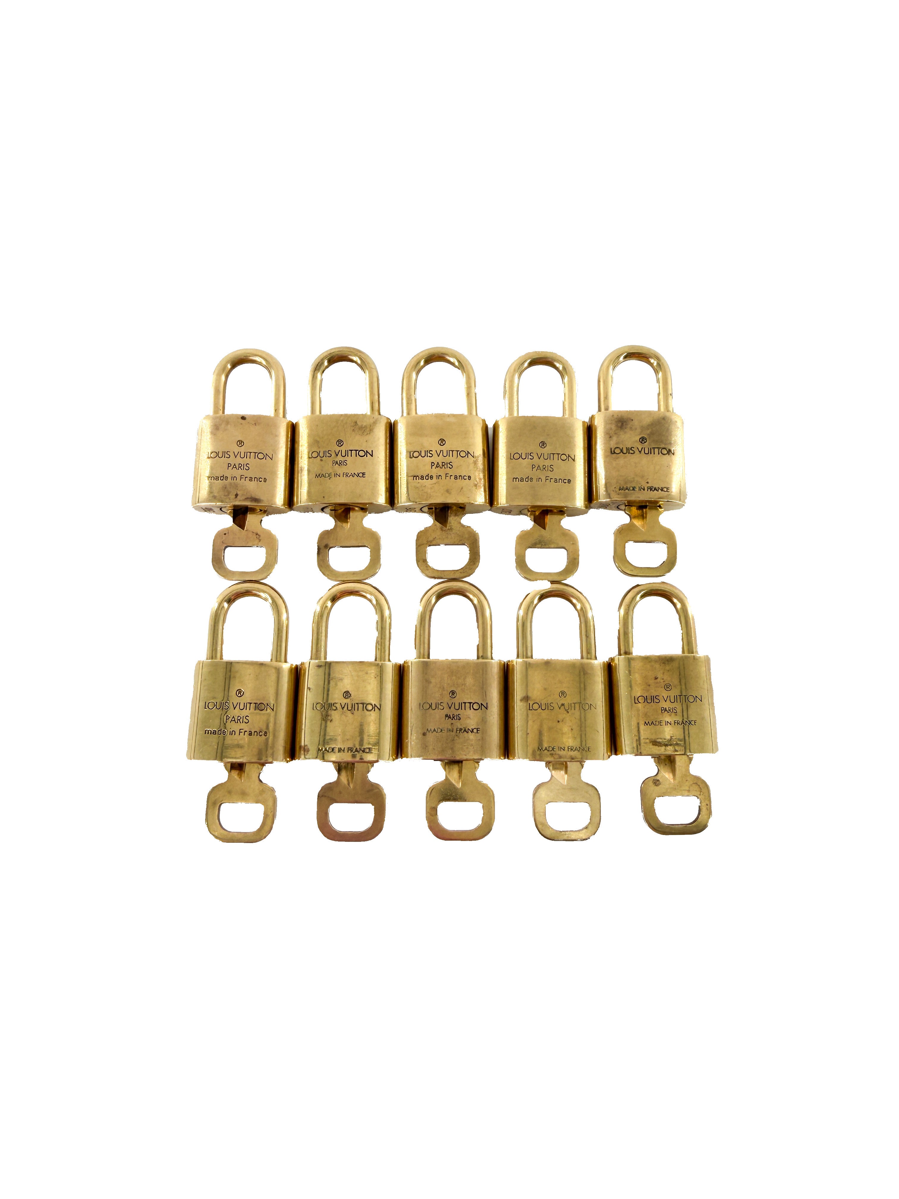 Louis Vuitton gold tone lock