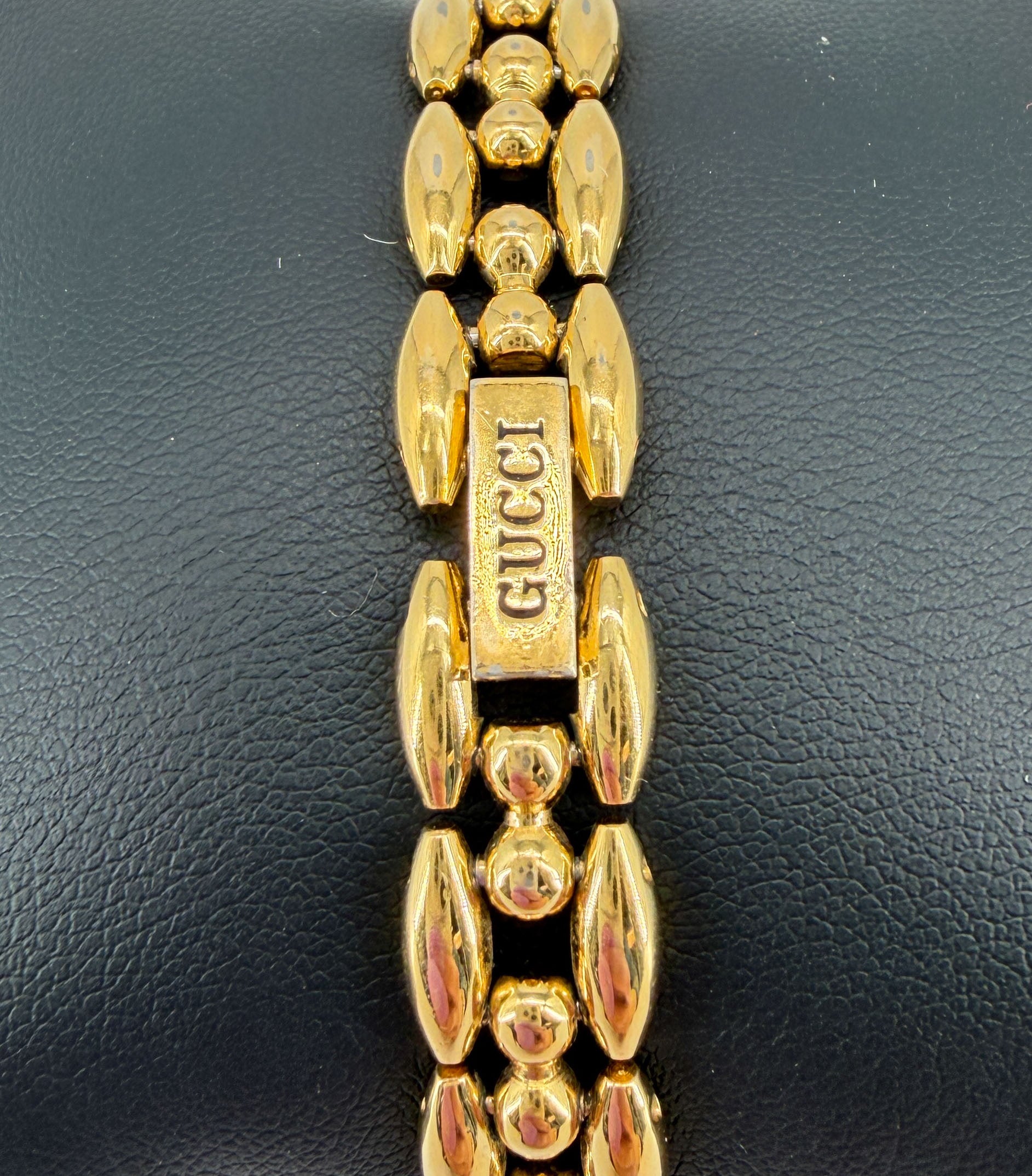 Gucci gold tone bezel watch with plates
