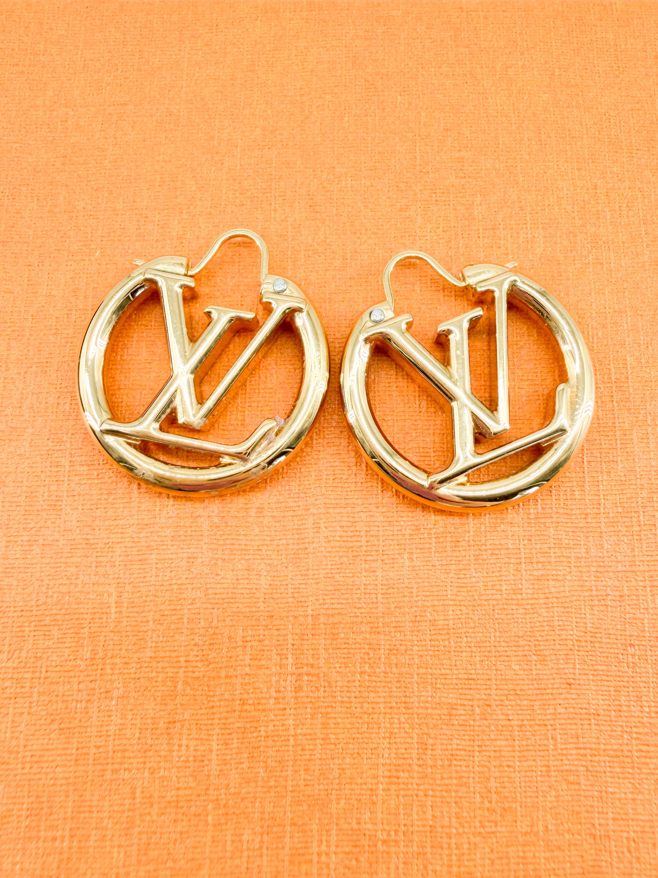 Louis Vuitton gold tone Louise earrings PM