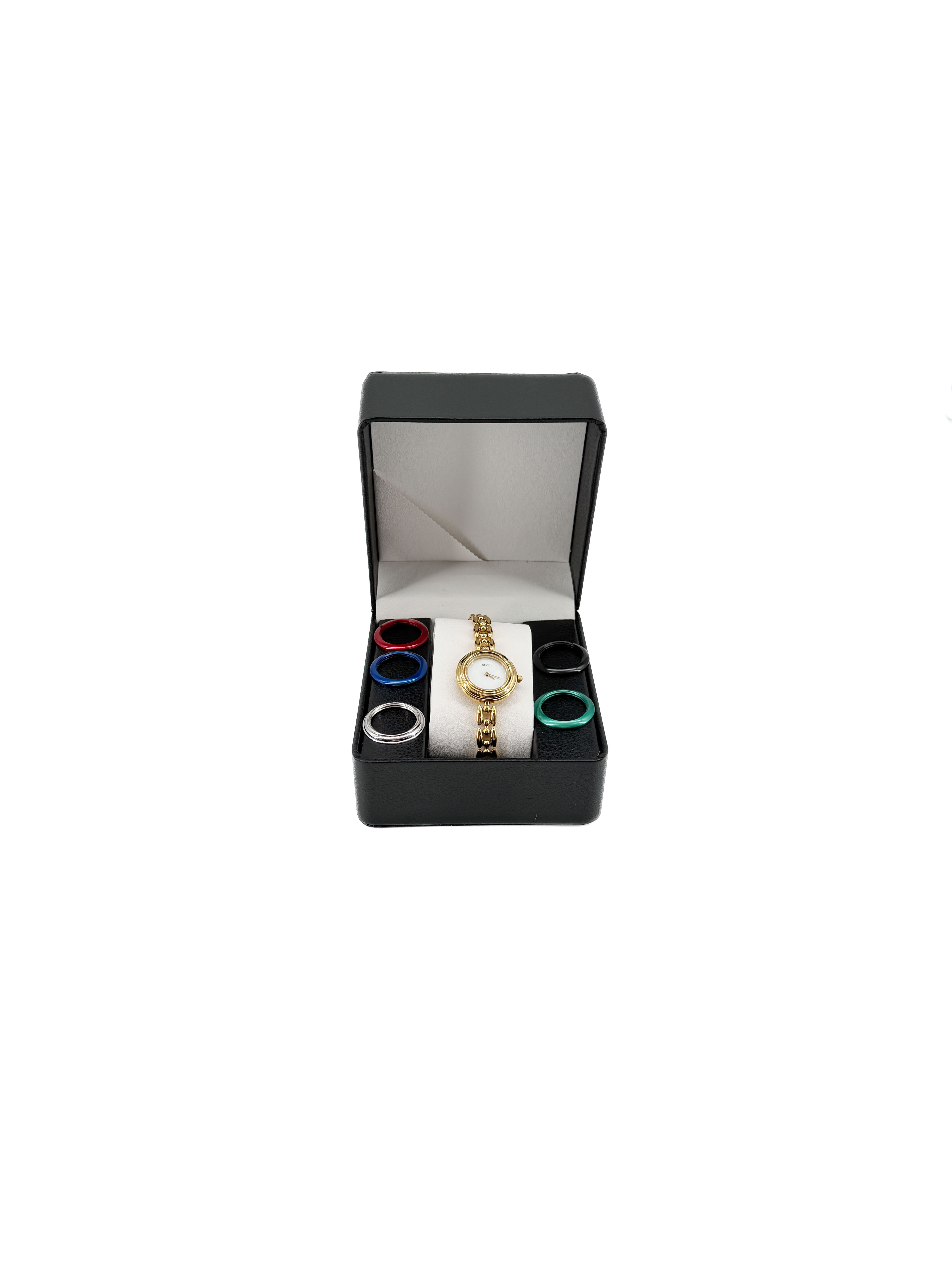 Gucci gold tone bezel watch with plates