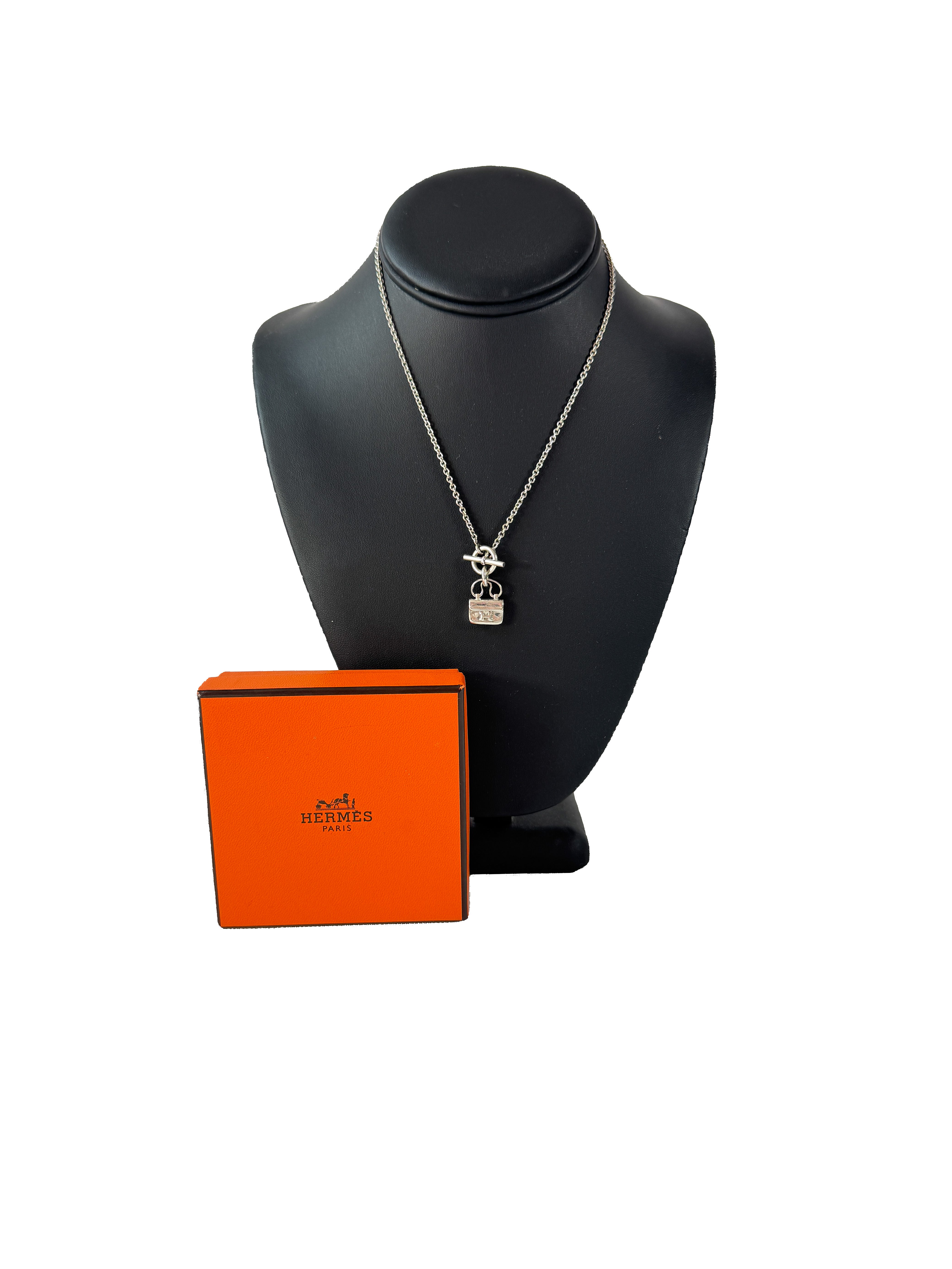 Hermès sterling silver constance amulet necklace retail $980