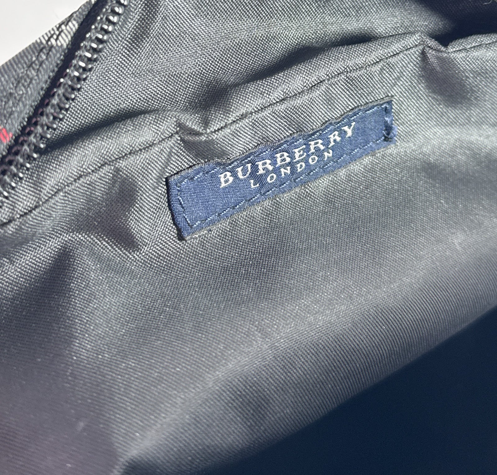 Burberry black, white, red plaid nylon backpack