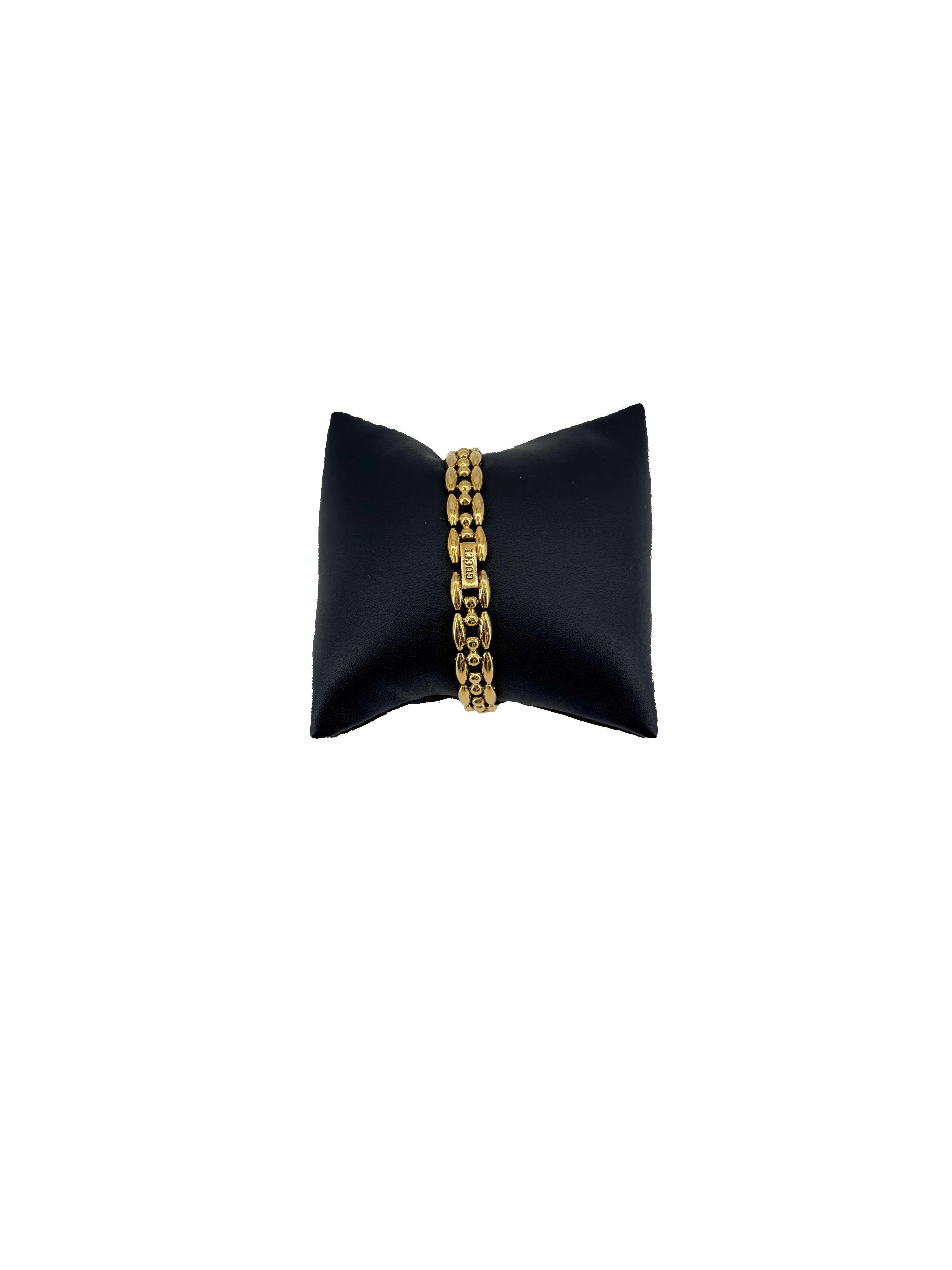 Gucci gold tone bezel watch with plates