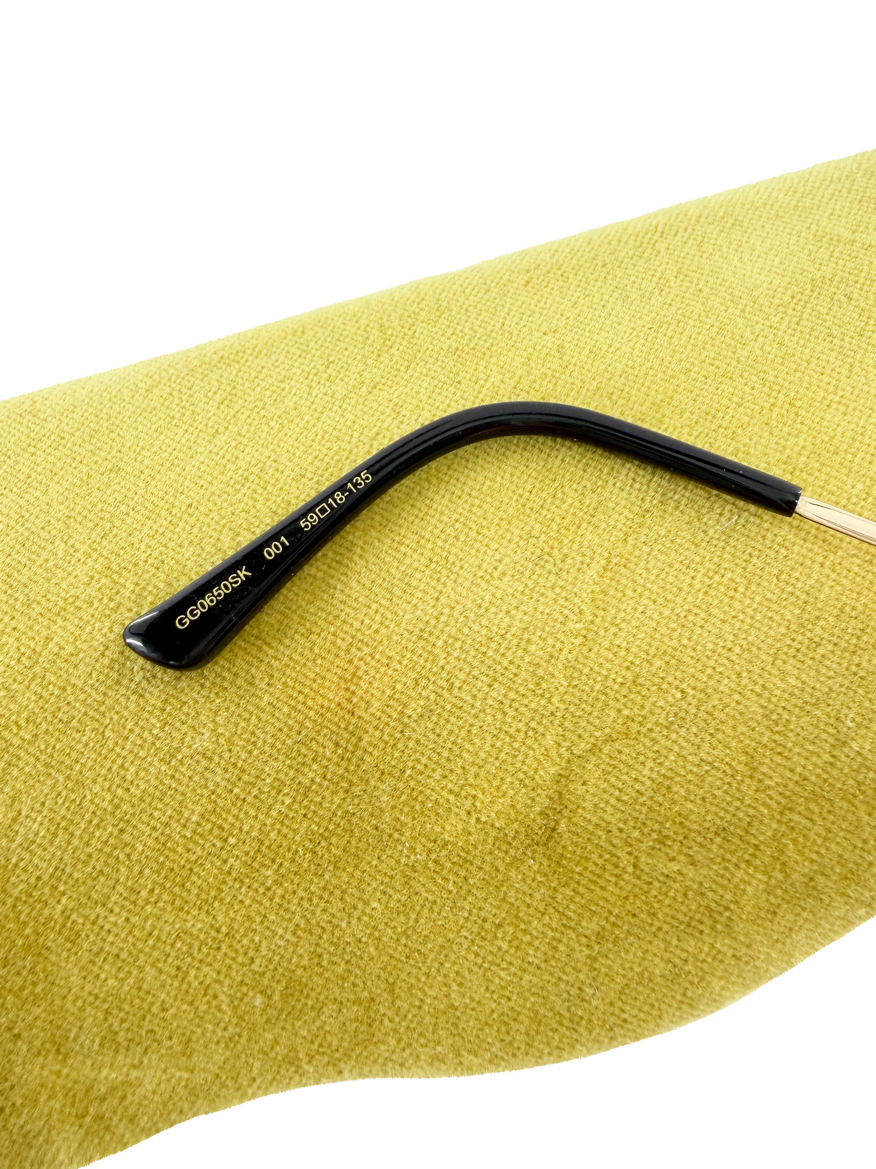 Gucci gold tone metal sunglasses GG0650SK