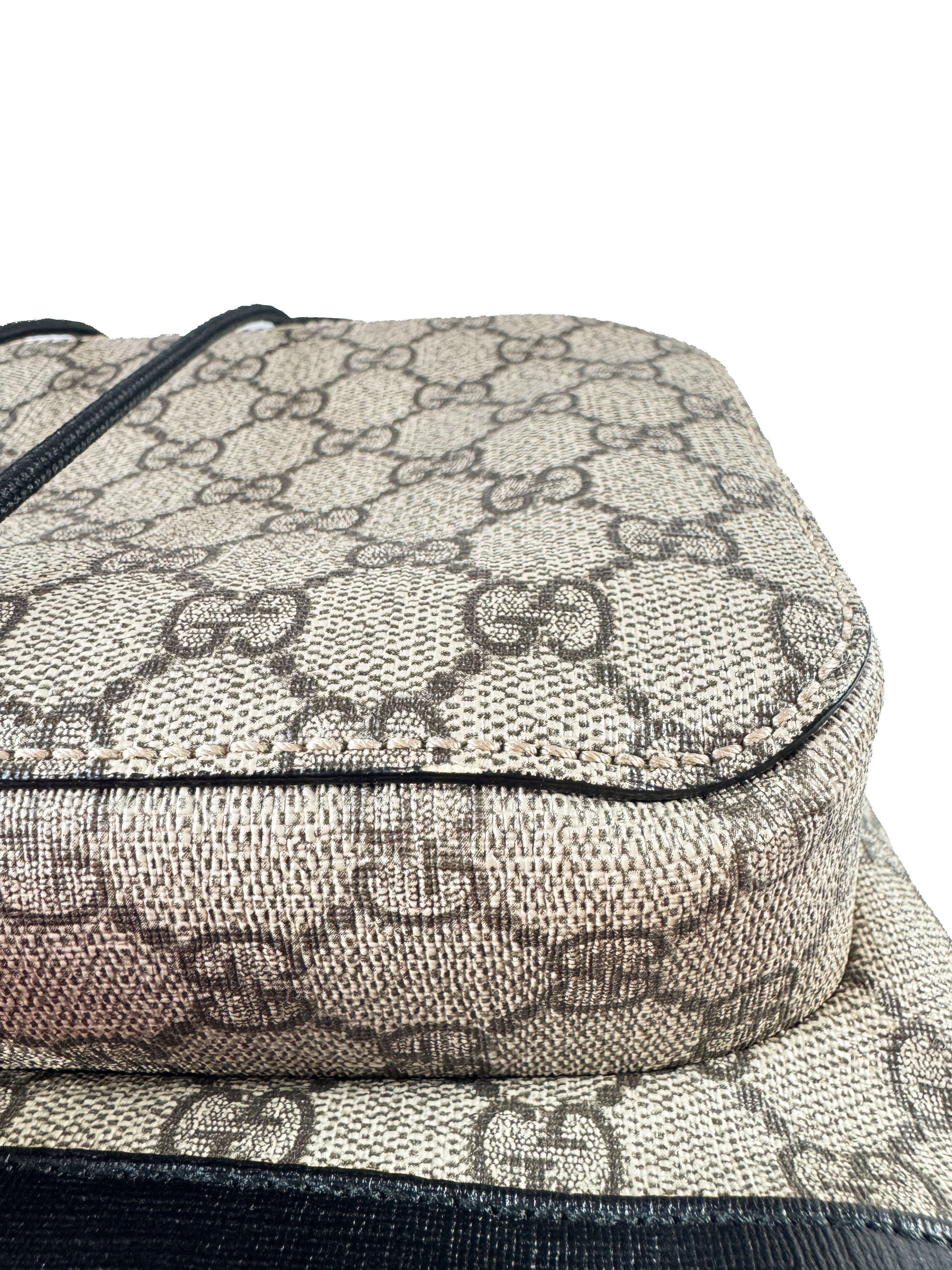 Gucci GG Supreme buckle backpack