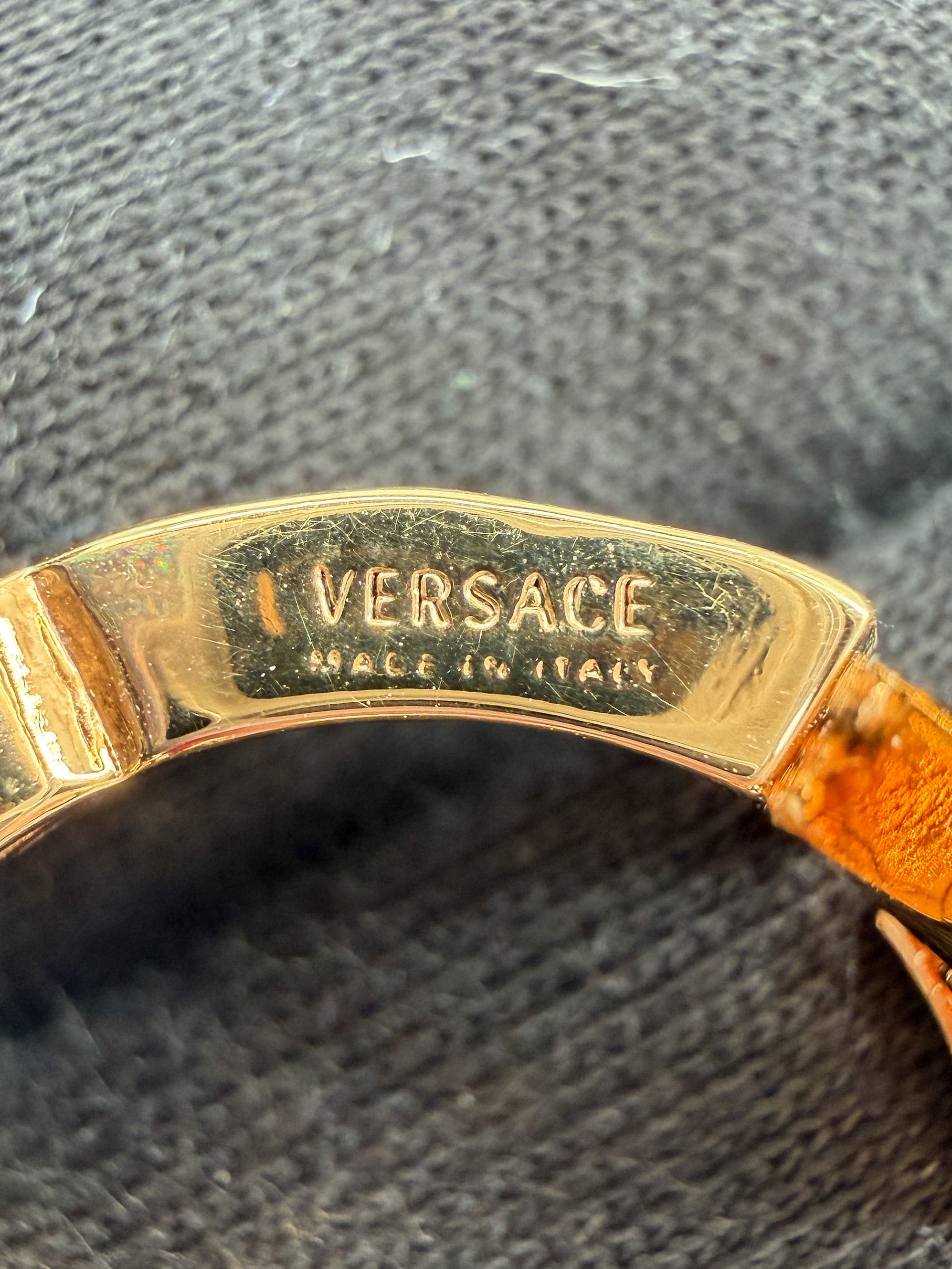 Versace gold tone logo ring