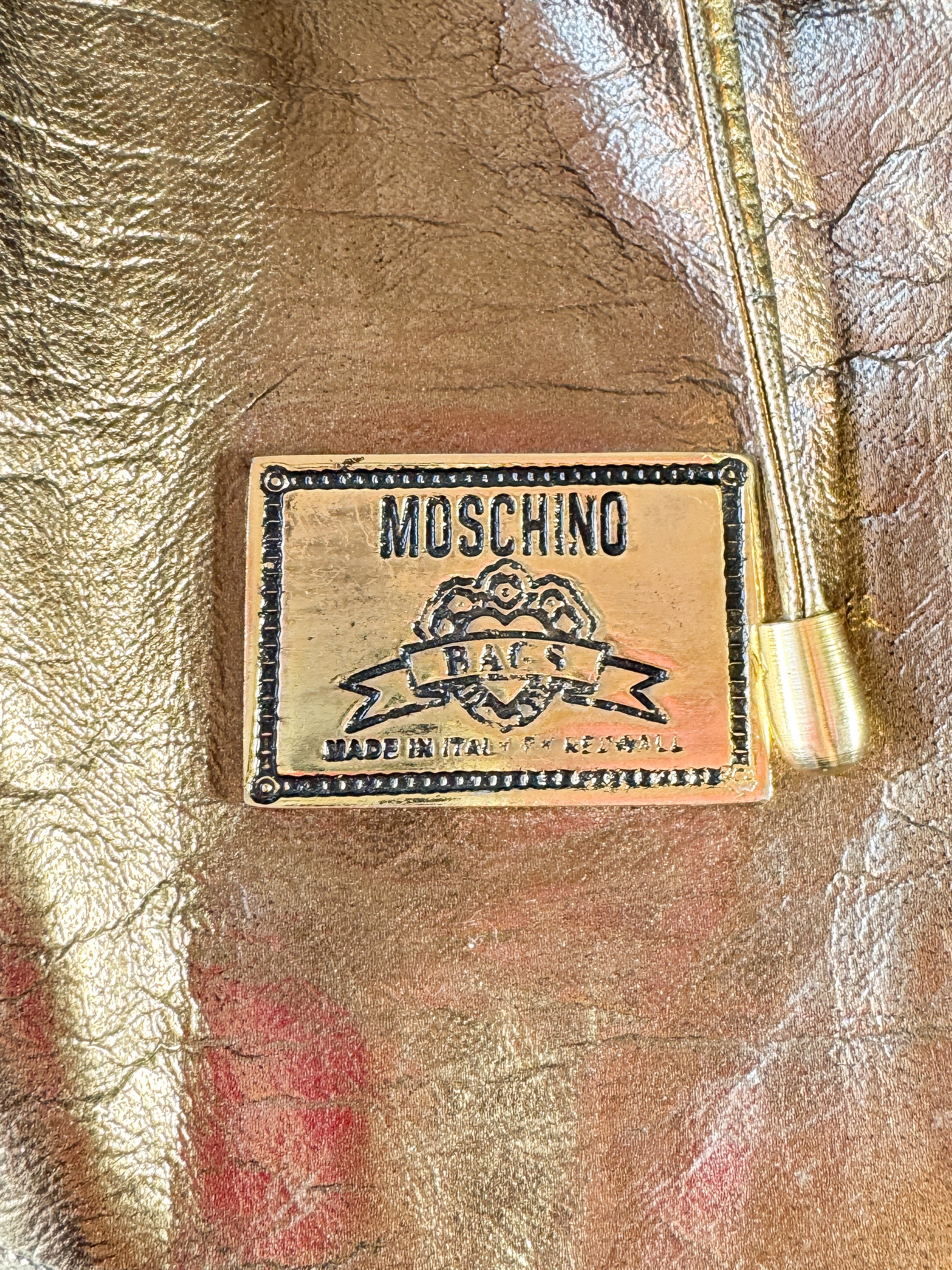 Moschino vintage Redwall bronze logo sling pack backpack