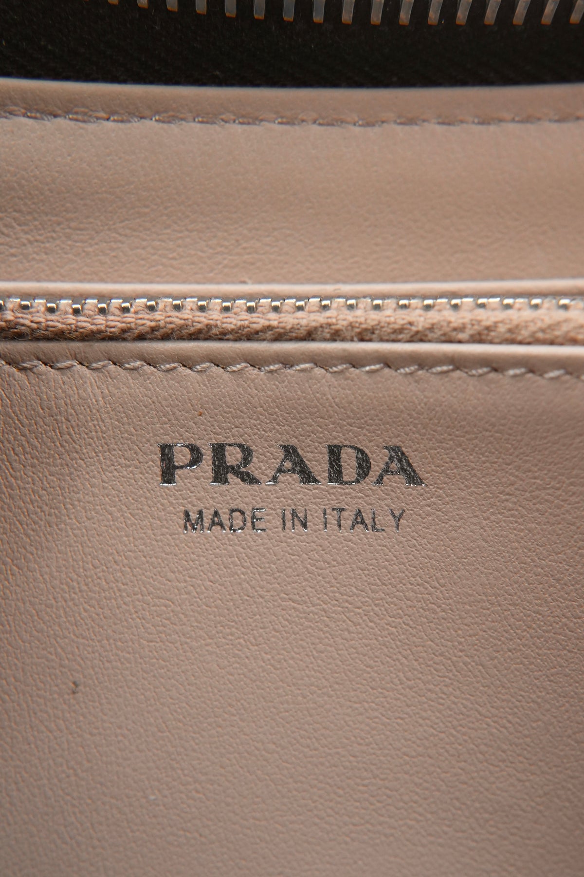 Prada black leather saffiano leather zip around 42
