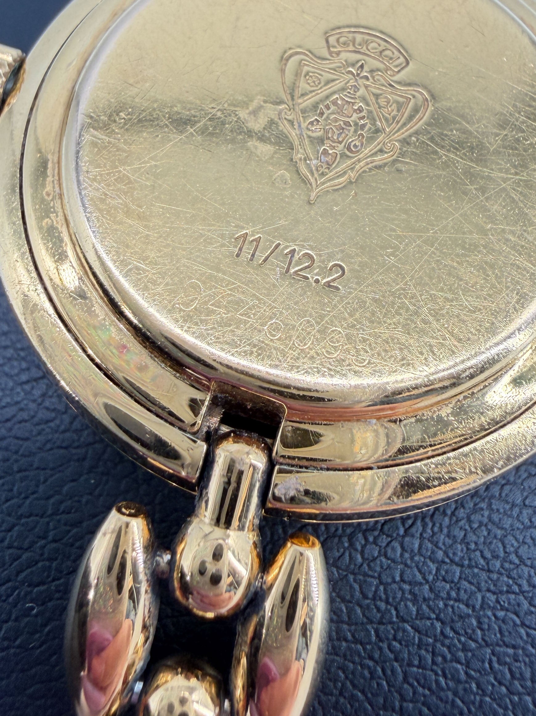Gucci gold tone bezel watch with plates