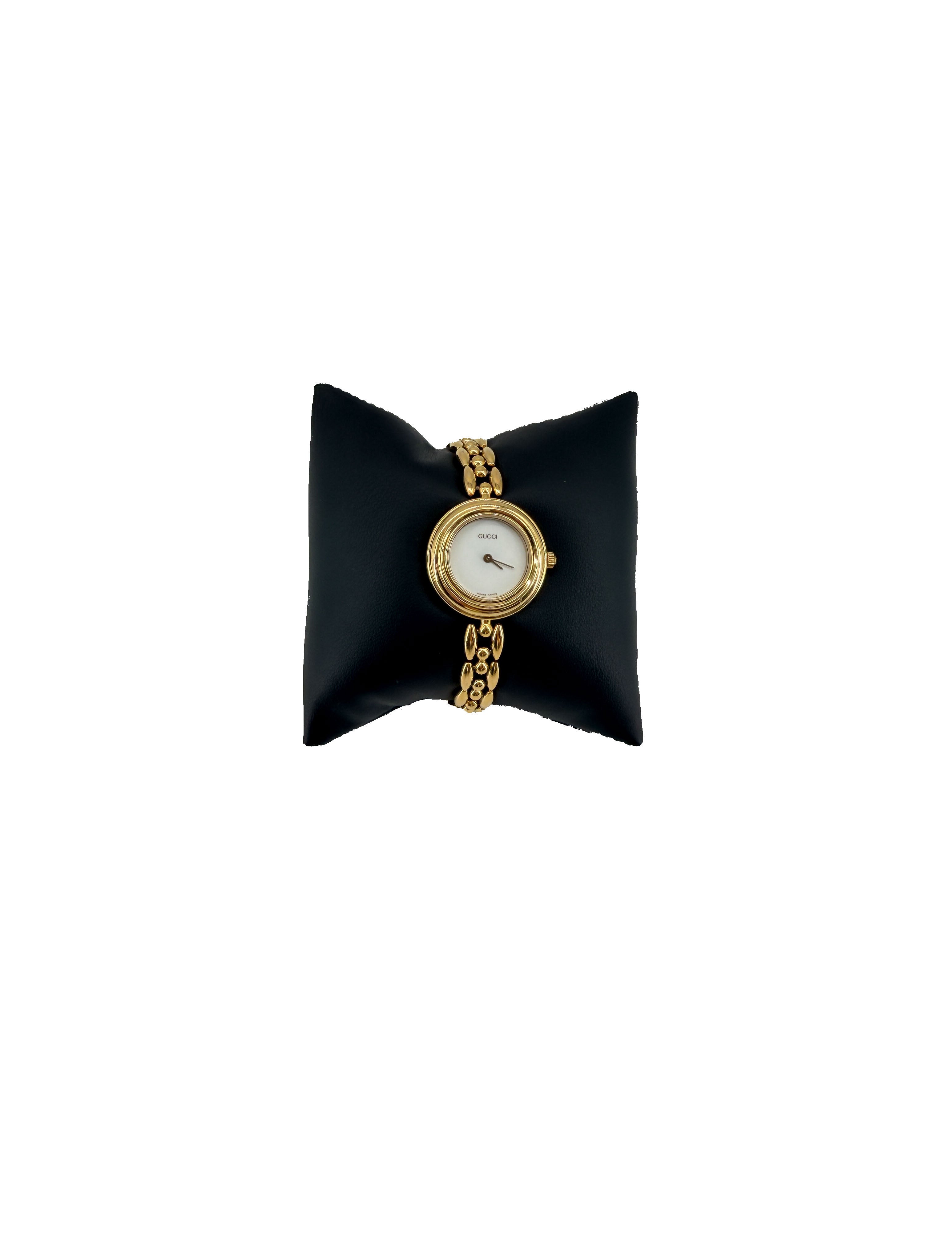 Gucci gold tone bezel watch with plates
