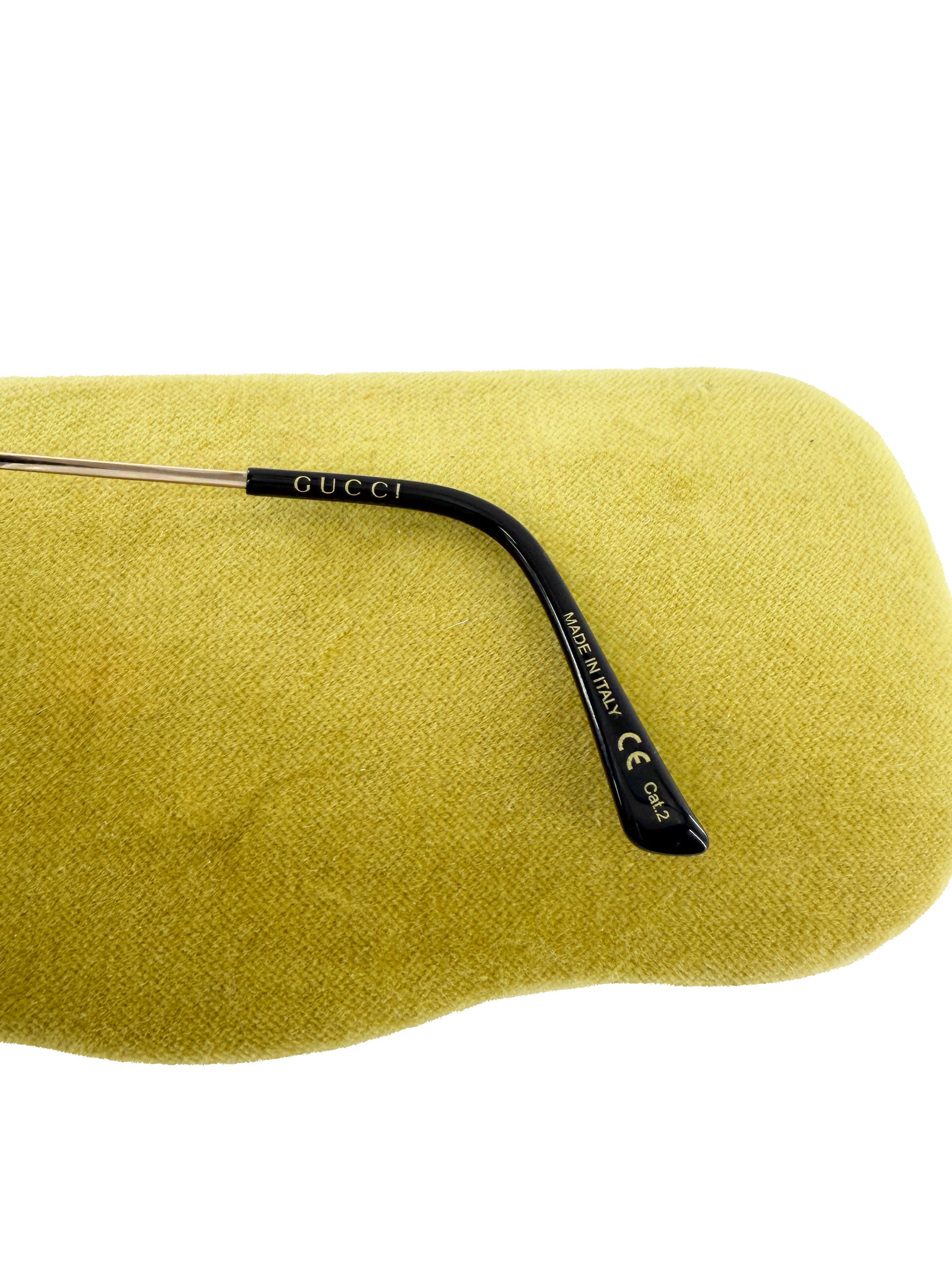 Gucci gold tone metal sunglasses GG0650SK