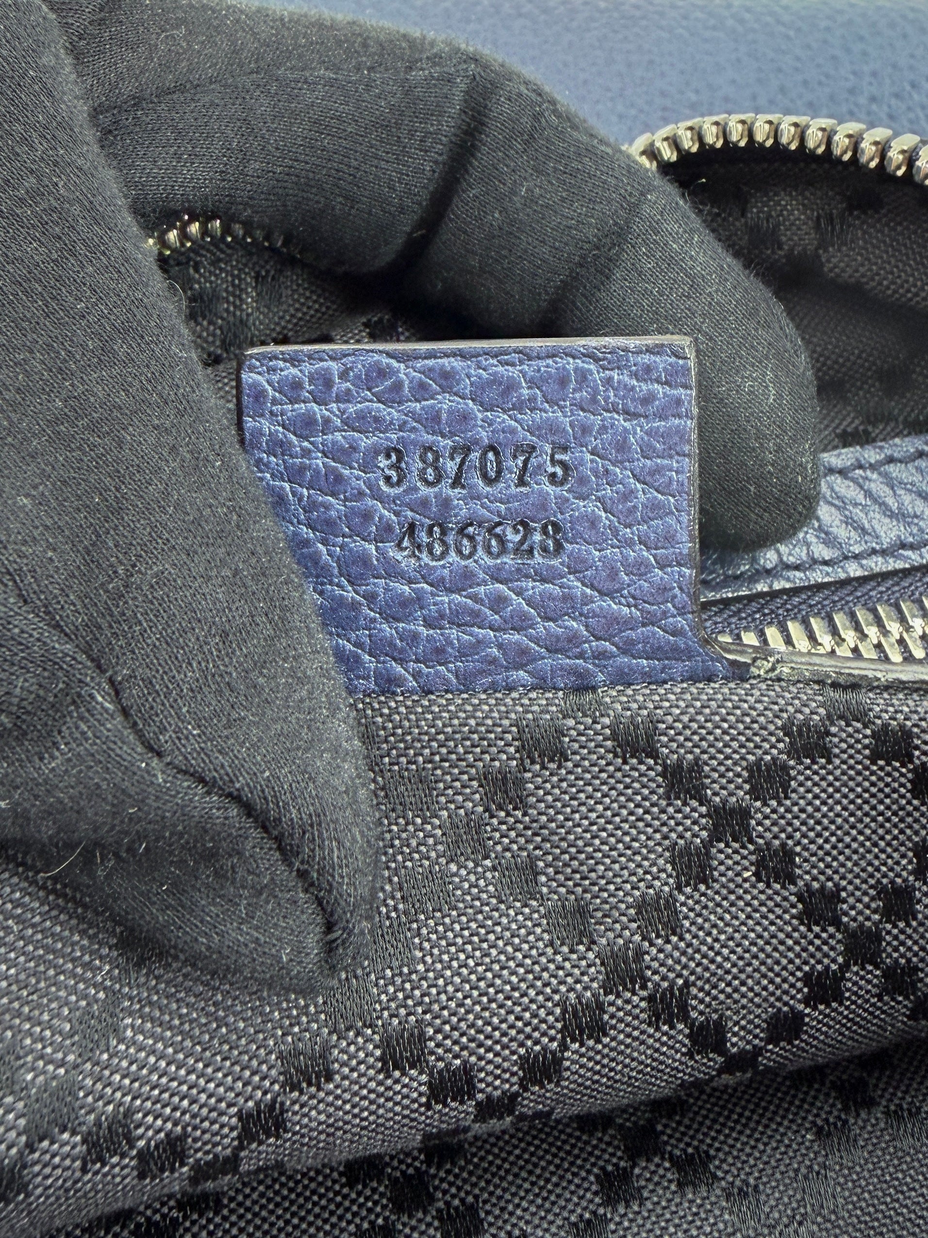 Gucci navy leather oversized wristlet 387075 486628