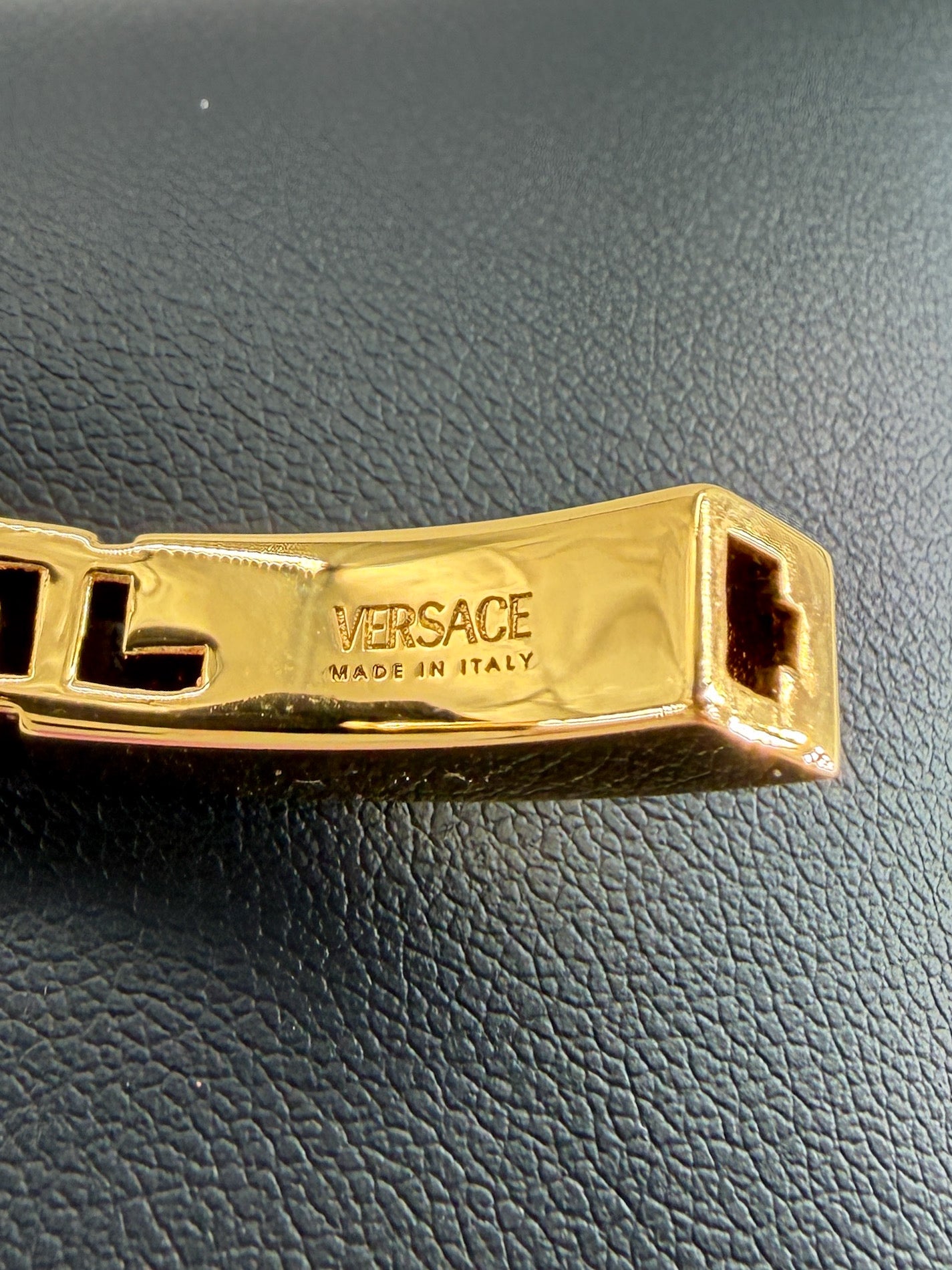 Versace gold tone Greca hinged bangle