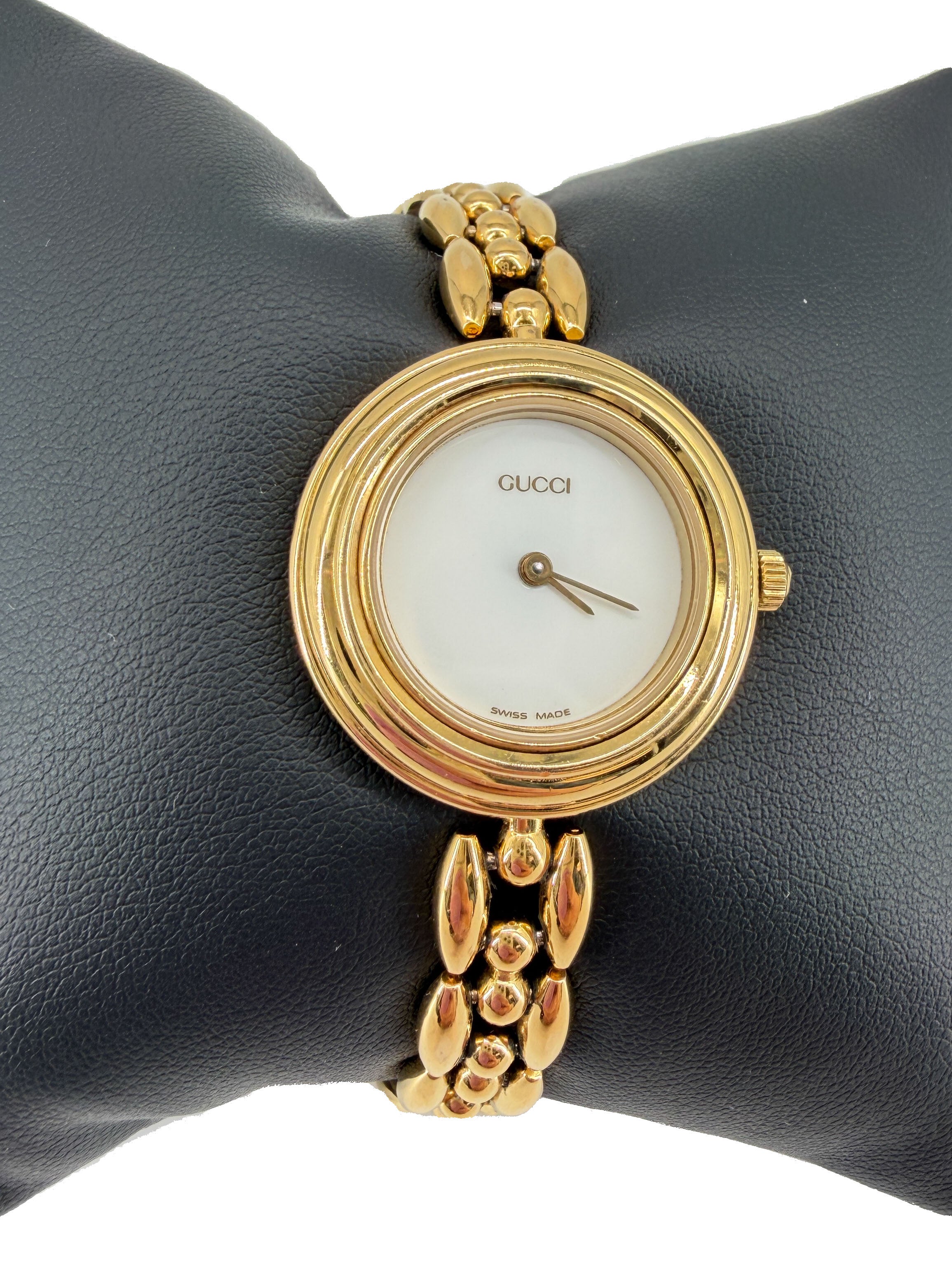 Gucci gold tone bezel watch with plates