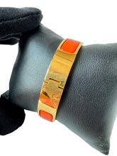 Hermès orange/gold clic H bangle GM FI 01 75
