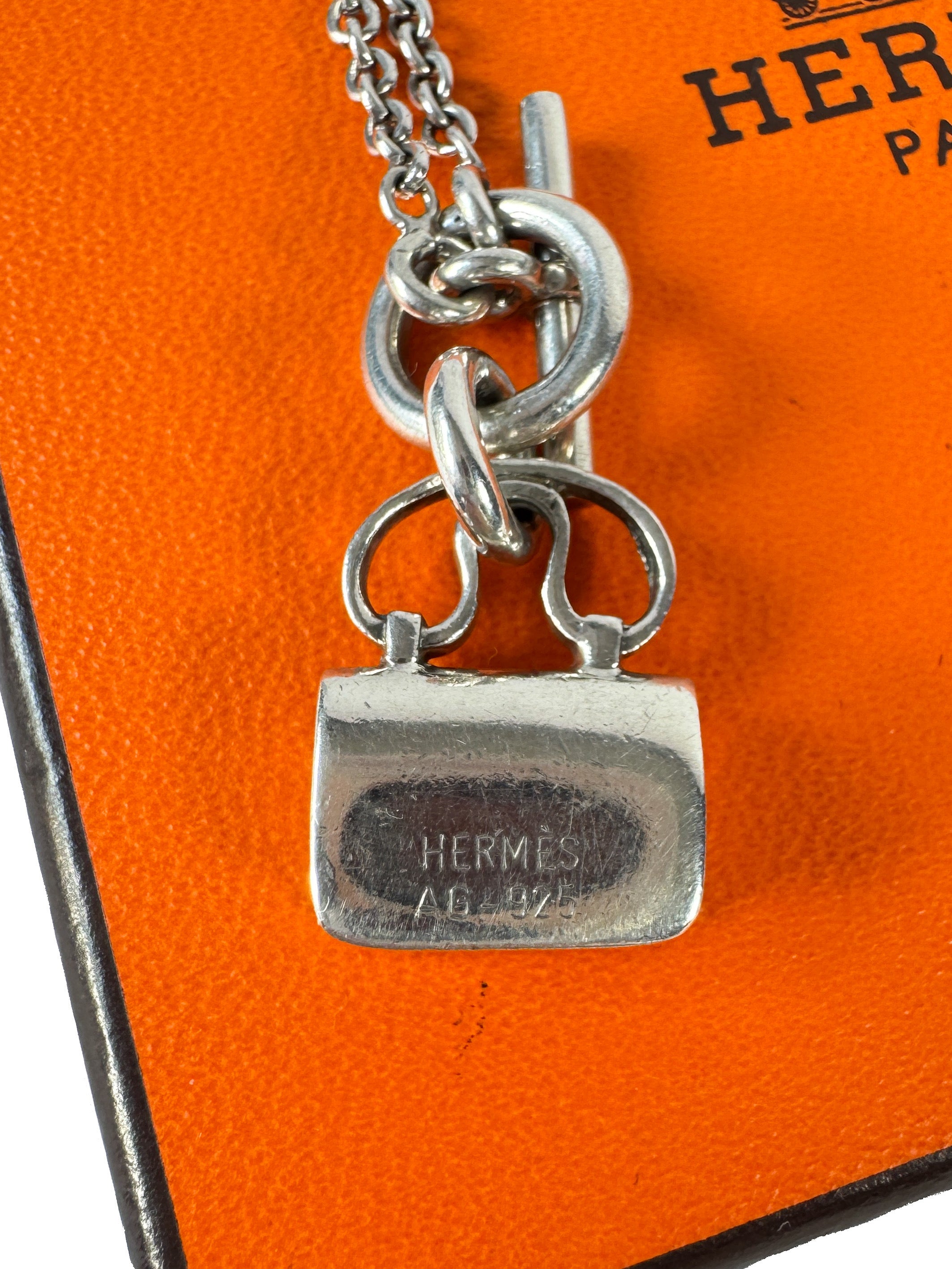 Hermès sterling silver constance amulet necklace retail $980