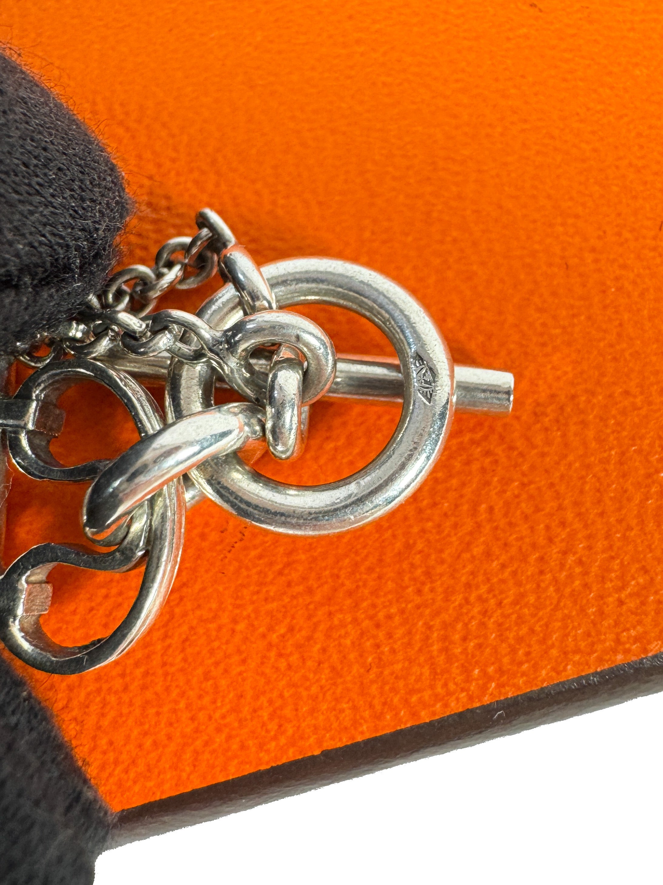 Hermès sterling silver constance amulet necklace retail $980