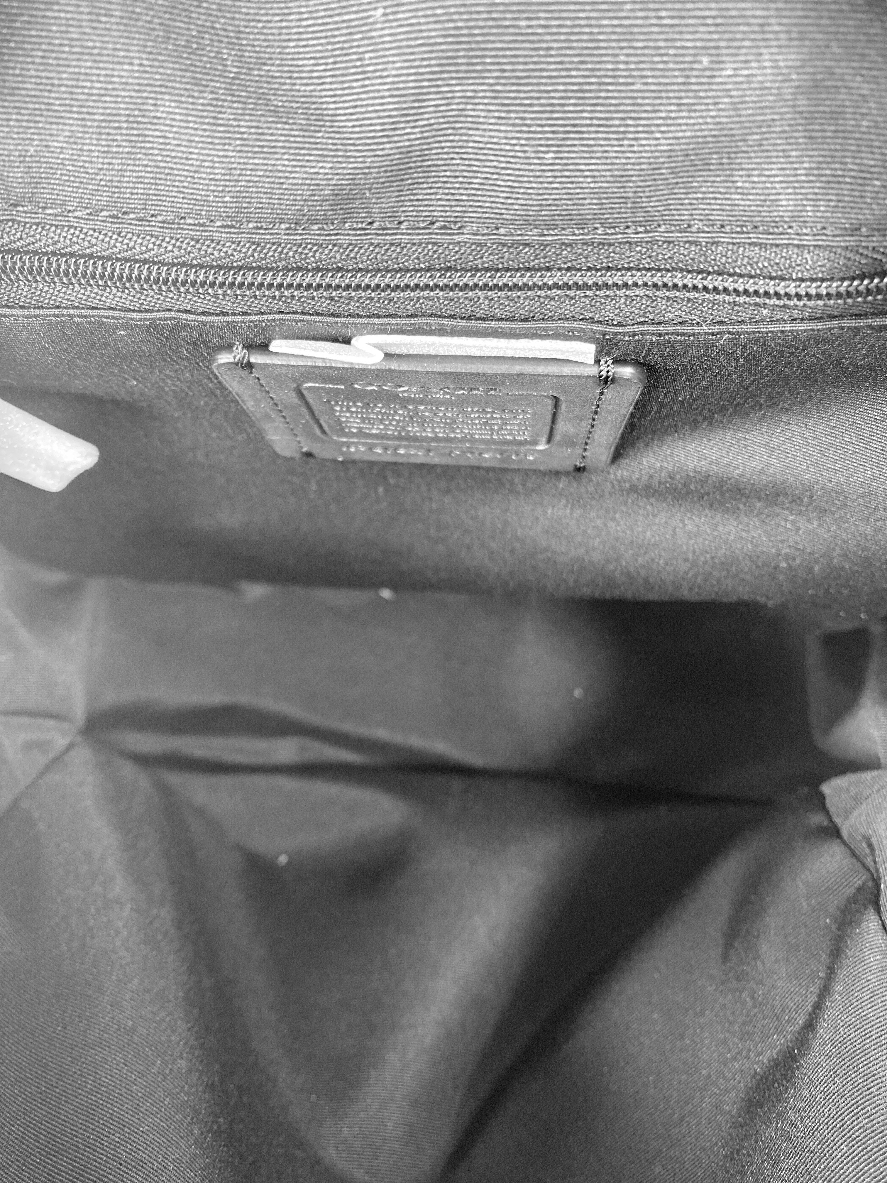 Coach black and brown signature floral backpack